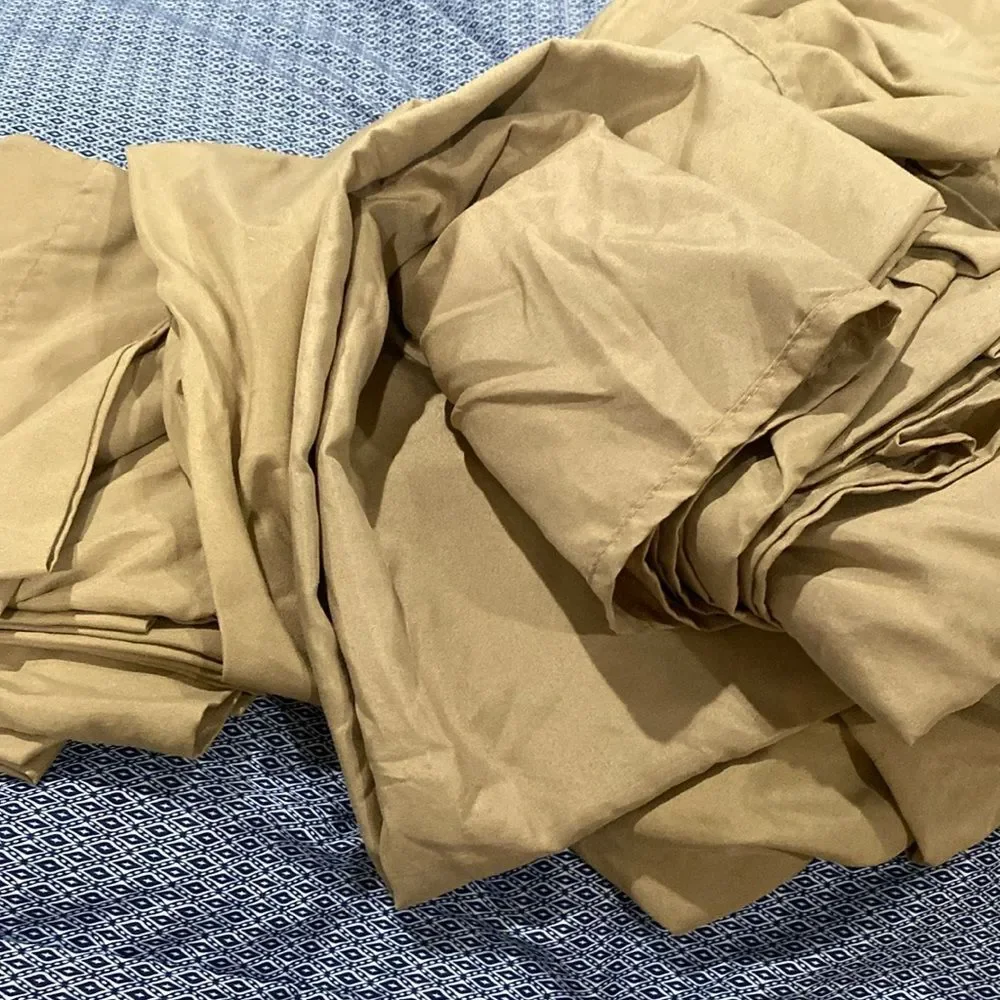 Queen size pillowcases flat, and fitted sheet in a gold color